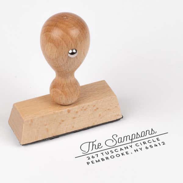 Sampson Script Return Address Stamp impression next to european stamp body