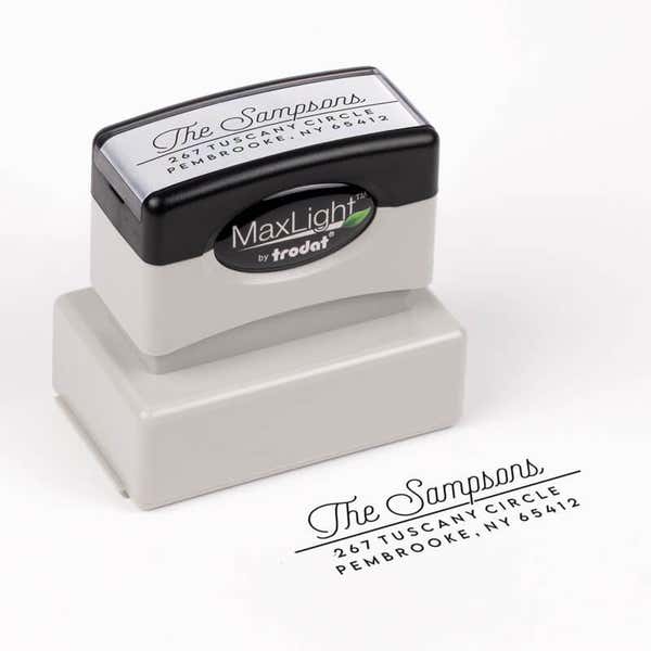 Sampson Script Return Address Stamp impression next to pre inked stamp body
