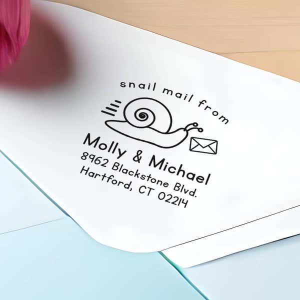 Snail Mail Custom Return Address Stamp impression close up on envelope