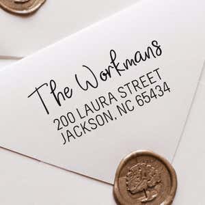 Workman Address Stamp impression close up on white envelope