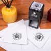 Nautical Coral Reef Round Address Stamp design impression on two envelopes next to self inking stamp body