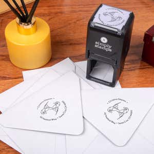 Nautical Lobster Round Address Stamp design impression on two envelopes next to self inking stamp body