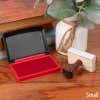 Opened Small Red Ink Pad with Hand Stamp