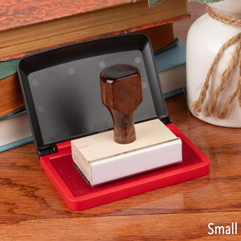 Opened Small Red Ink Pad with Hand Stamp on Top