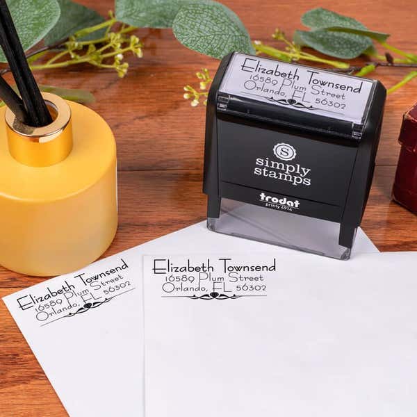 Natural Deco Accent Return Address Stamp Design stamped on two envelopes next to self inking stamp body