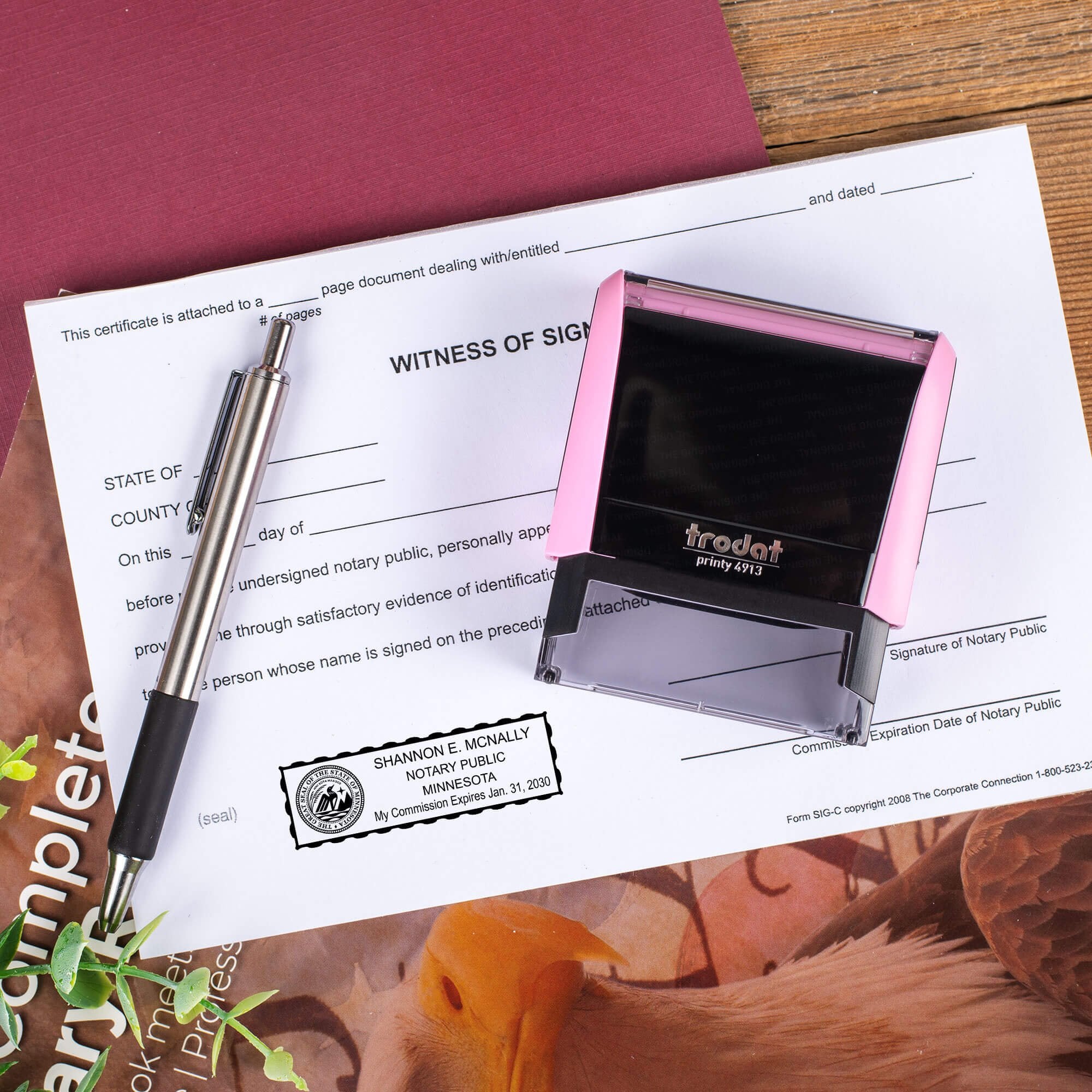 Minnesota Pink Rectangle Notary Stamp on a document