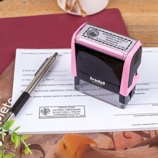 Minnesota Pink Rectangle Notary Stamp on a document