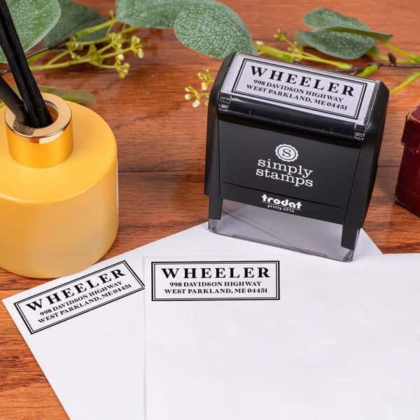 Boxed Serif Stamp Impression on Envelope Next to Stamp Body