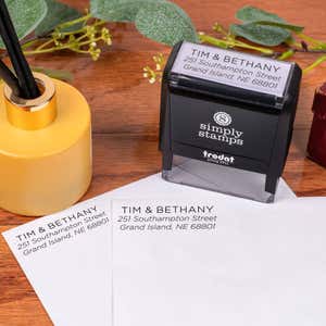 Light Sans Serif Address Stamp impression on two envelopes