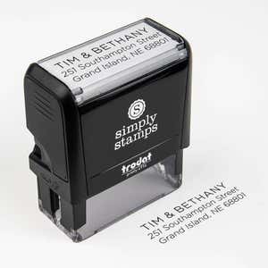 Light Sans Serif Address Self-Inking Stamp Body at an angle next to impression