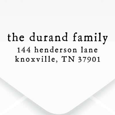 The impression made from the Dupont Brush Return Address Stamp on grey paper