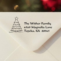Personalized ‘Christmas Tree Custom’ address stamp impression on envelope flap for holiday cards.