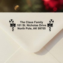 Personalized ‘Bold Candy Canes’ address stamp impression on envelope flap for holiday cards.