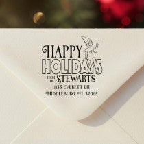 Personalized ‘Cartoon Elf’ address stamp impression on envelope flap for holiday cards.