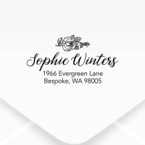 Floral Script Return Address Stamp on an envelope 