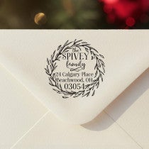 Personalized ‘Christmas Wreath Outline’ address stamp impression on envelope flap for holiday cards.