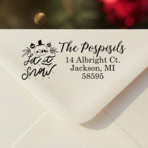 Personalized ‘Let It Snow Winter Snowman’ address stamp impression on envelope flap for holiday cards.
