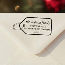 Personalized ‘Madison Gift Tag’ address stamp impression on envelope flap for holiday cards.