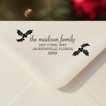 Personalized ‘Madison Holly’ address stamp impression on envelope flap for holiday cards.