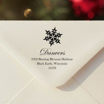 Personalized ‘Danvers Snowflake’ address stamp impression on envelope flap for holiday cards.