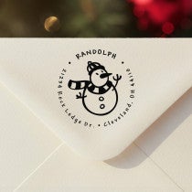 Personalized ‘Scarved Snowman’ address stamp impression on envelope flap for holiday cards.