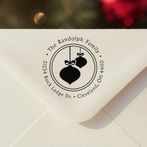 Personalized ‘Randolph Christmas Ornaments’ address stamp impression on envelope flap for holiday cards.