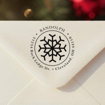 Personalized ‘Eight Point Snowflake’ address stamp impression on envelope flap for holiday cards.