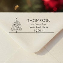 Personalized ‘Curly Christmas Tree’ address stamp impression on envelope flap for holiday cards.