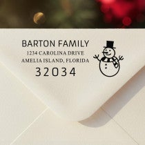 Personalized ‘Snowman’ address stamp impression on envelope flap for holiday cards.