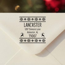 Personalized ‘Designer Reindeer’ address stamp impression on envelope flap for holiday cards.