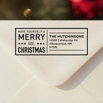 Personalized ‘Have Yourself A Merry Little Christmas’ address stamp impression on envelope flap for holiday cards.