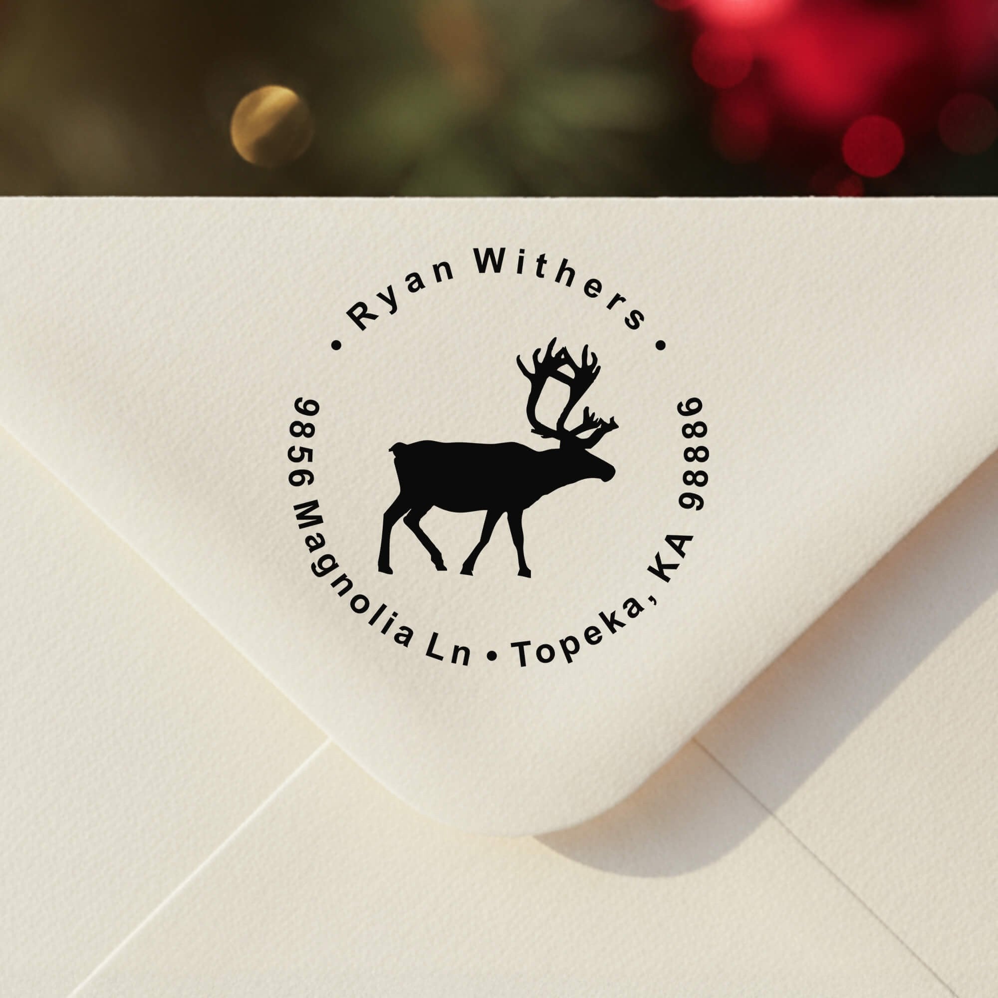 Personalized ‘Holiday Reindeer Custom’ address stamp impression on envelope flap for holiday cards.