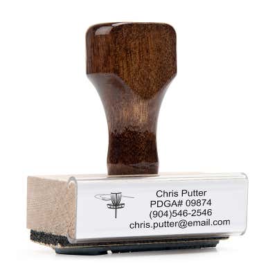 The Disc Golf Custom Label Stamp is a traditional wood handle stamp that works with an external ink pad