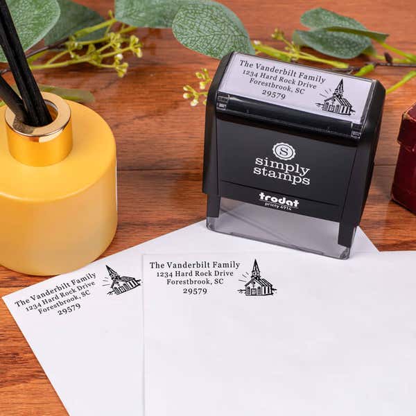 Church Building Rectangle Address Stamp design impression on two envelopes next to self inking stamp body
