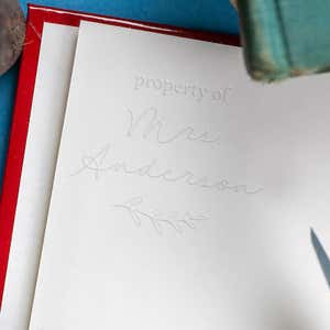 Minimalist Script Property Of Embosser on the Inside of a Book