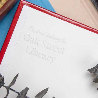 Another Example of Modern Serif Book Embosser Impression on Inside of Book