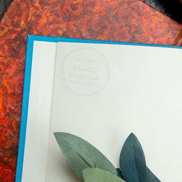 Round hearts personalized book embosser impression on a book