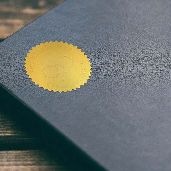 Round Eyeglasses book embosser Impression on Gold Sticker