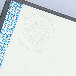 Impression of Modern Sun Embosser Impression on White Paper
