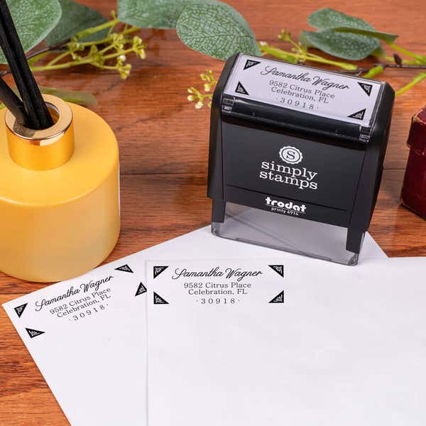 Wagner Fancy Border Address Stamp design impression on two envelopes next to self inking stamp body