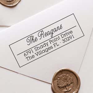 Villages Address Stamp impression close up on white envelope