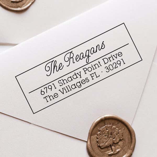 Villages Address Stamp impression close up on white envelope