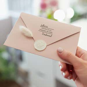 Davenport Offset Address Stamp Impression on envelope in person's hand