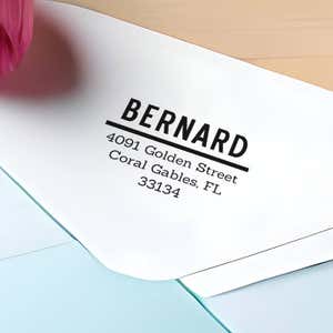 Bernard Bold Address Stamp impression close up on white envelope