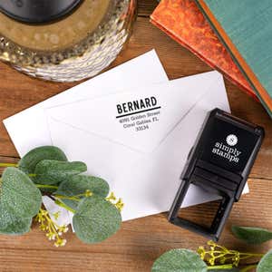 Bernard Bold Address Stamp impression on front of two envelopes top down view