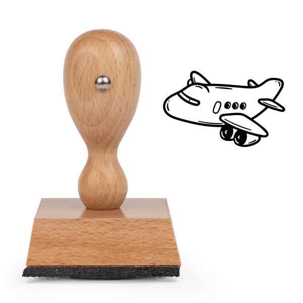 Airplane Craft Stamp standing upright beside its black stamped airplane image