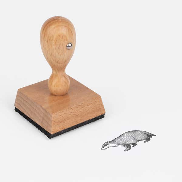 Woodland Badger Craft Stamp at an angle with its wooden handle and block