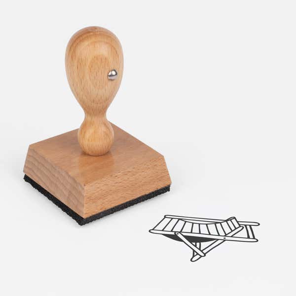 Beach Chair Craft Stamp at an angle with its wooden handle and block