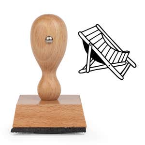 Beach Chair Craft Stamp standing upright beside its black stamped beach chair image