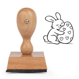 Hoppy Bunny Egg Craft Stamp standing upright beside its black stamped bunny hugging an egg image